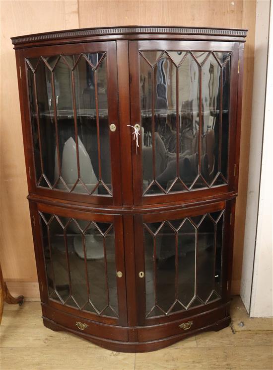 A 1920s mahogany bowfront display cabinet W.125cm